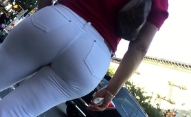 Hot Babe In Tight White Jeans Is Followed By A Street Voyeur